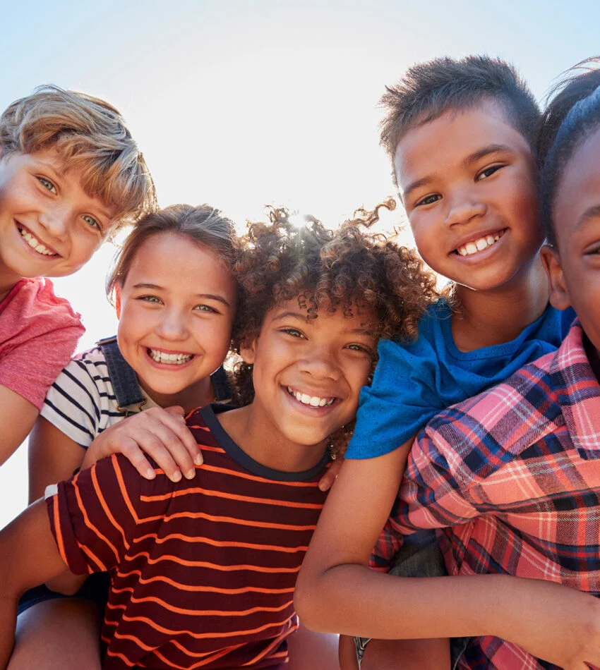 Smiling children posing together in kids ministry